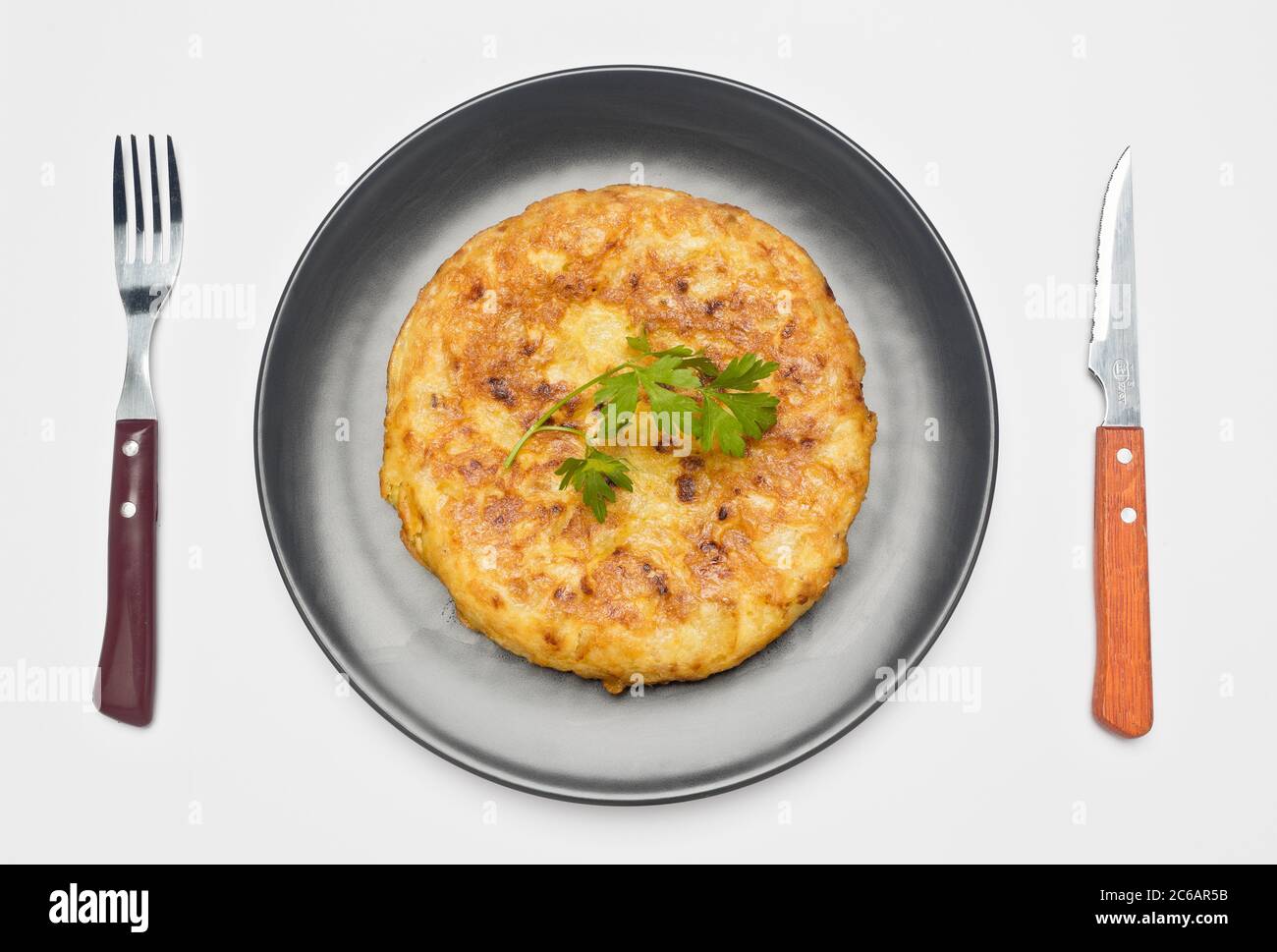The Spanish omelette, potato omelette or Spanish omelette - also called potato omelette in Latin America, the Canary Islands or Andalusia - is an omel Stock Photo