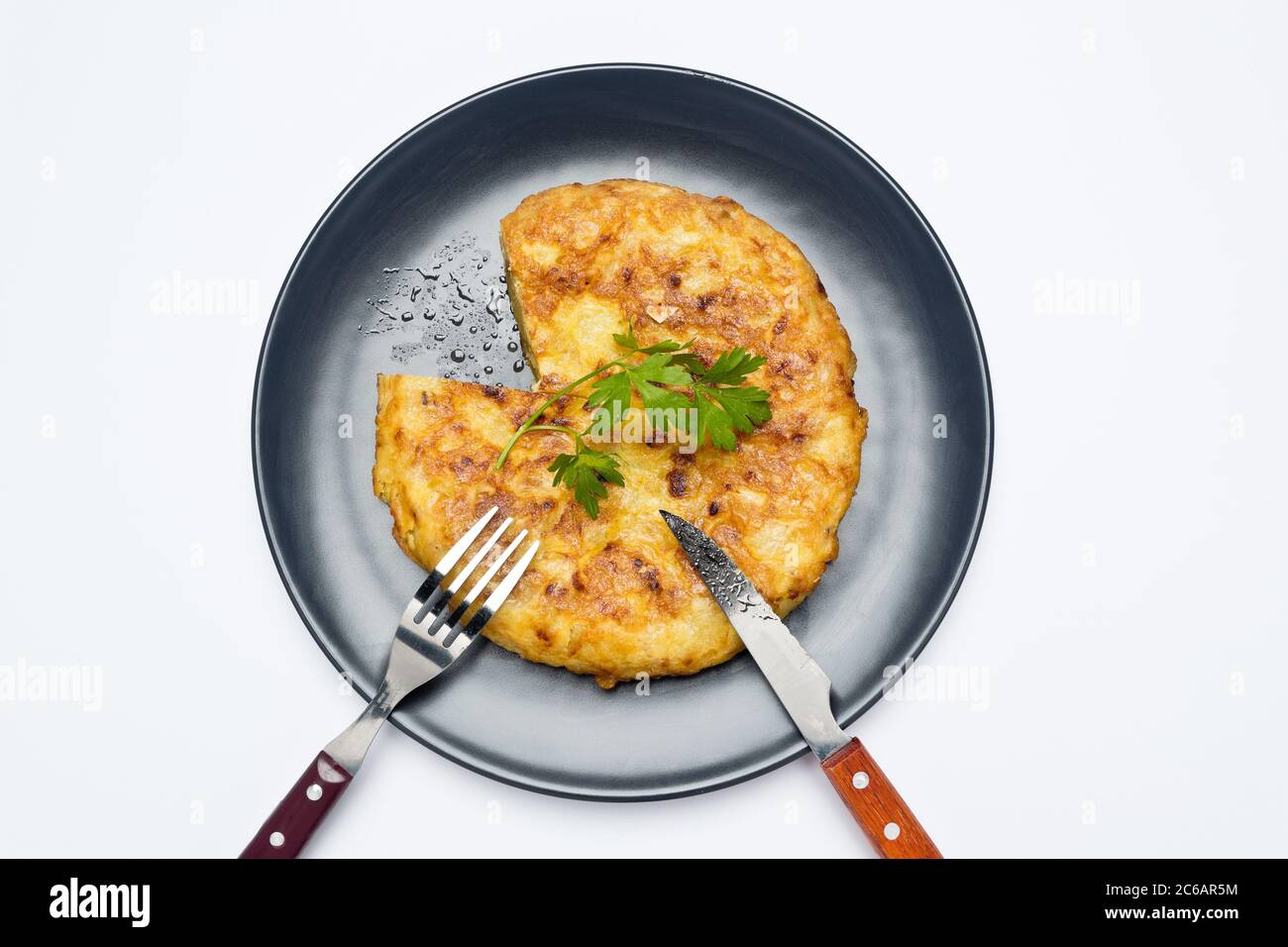 The Spanish omelette, potato omelette or Spanish omelette - also called potato omelette in Latin America, the Canary Islands or Andalusia - is an omel Stock Photo