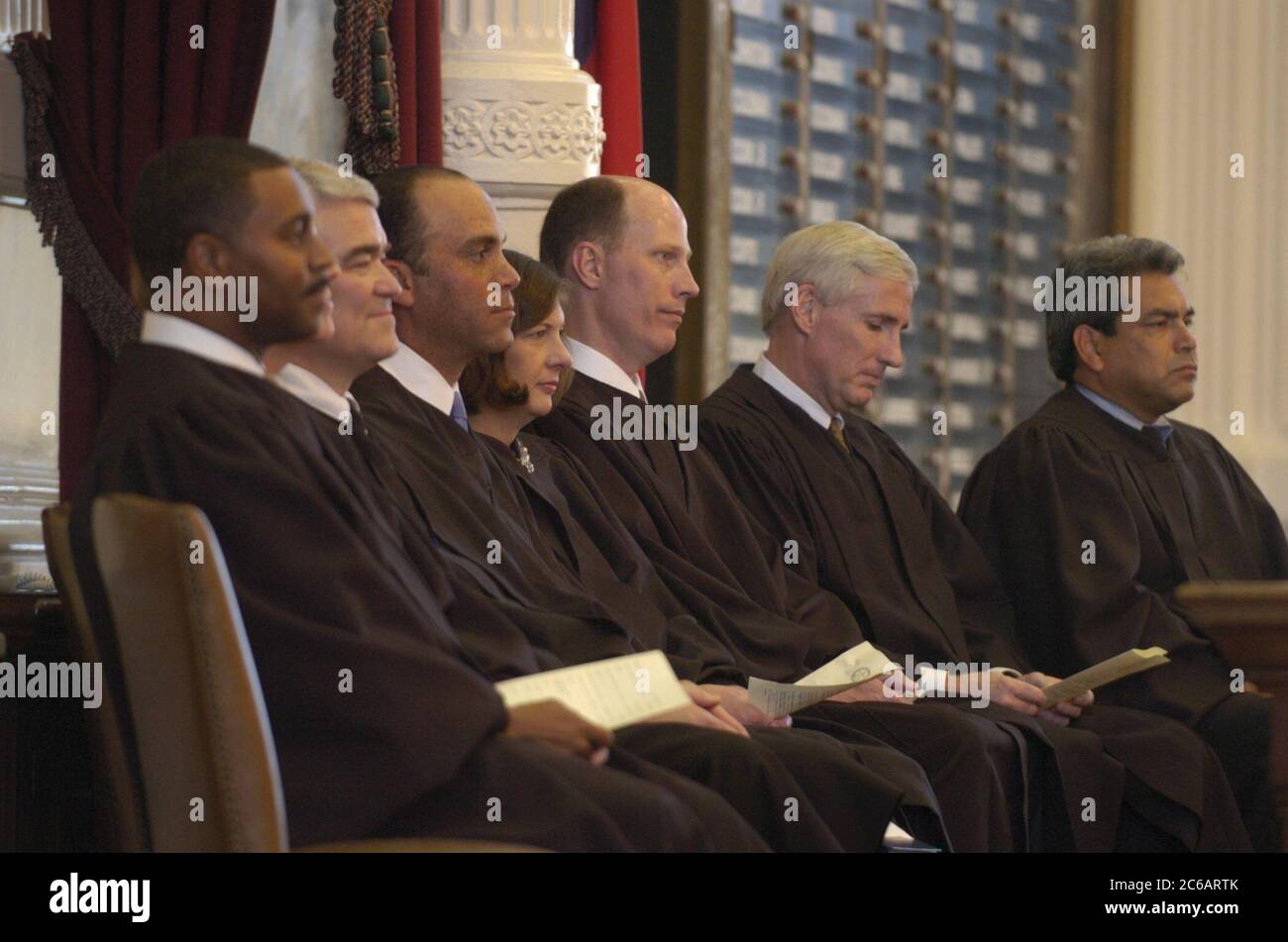 Austin, Texas USA, November 11 2004:  The Texas Supreme Court in session in the House of Representatives Chamber in the Texas Capitol for the investiture ceremony of Justice Wallace Jefferson (third from left).  ©Bob Daemmrich Stock Photo