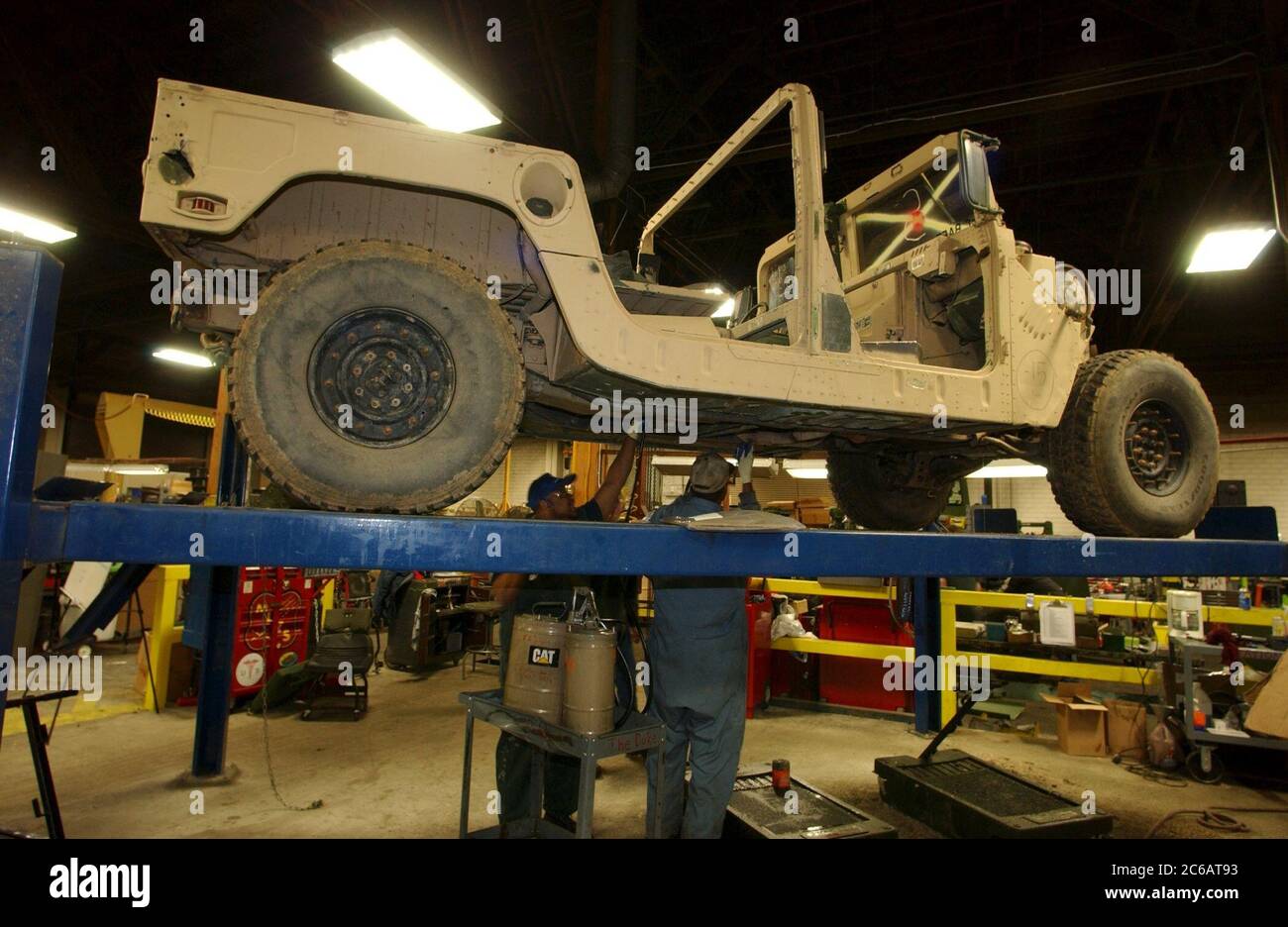 New Boston, Texas USA, November 22 2004: Workers at the Red River Army Depot rush to repair, renew and re-armor military Humvees bound for the war in Iraq.  Round-the-clock shifts of mechanics are working at the 33,000-acre military base in northeast Texas. ©Bob Daemmrich Stock Photo