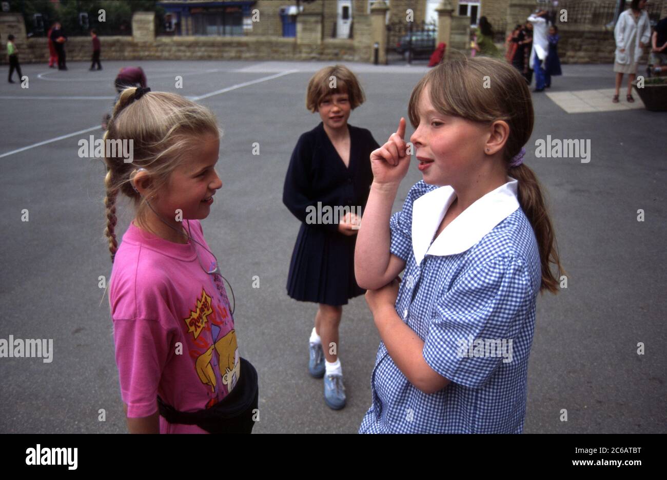 Hearing impaired and able bodied children in school playground; Yorkshire UK Stock Photo