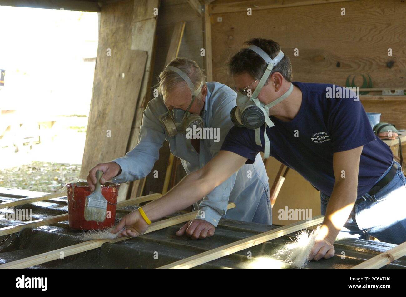 Flour Bluff Texas USA, December 7 2004: Stoner Boat Works, where veteran boat builder Robert Stoner and son Adam work on another custom hull. The Stoners are making a fiberglass mold for a boat.  ©Bob Daemmrich Stock Photo