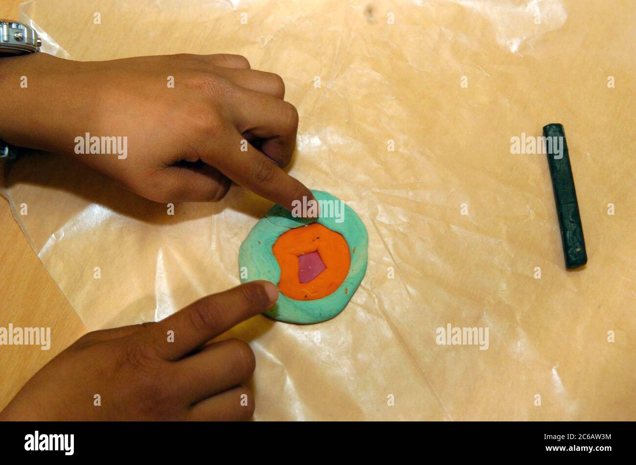 Austin Texas USA, 2005: Young student molds a craft project out of clay during after-school art class. Stock Photo