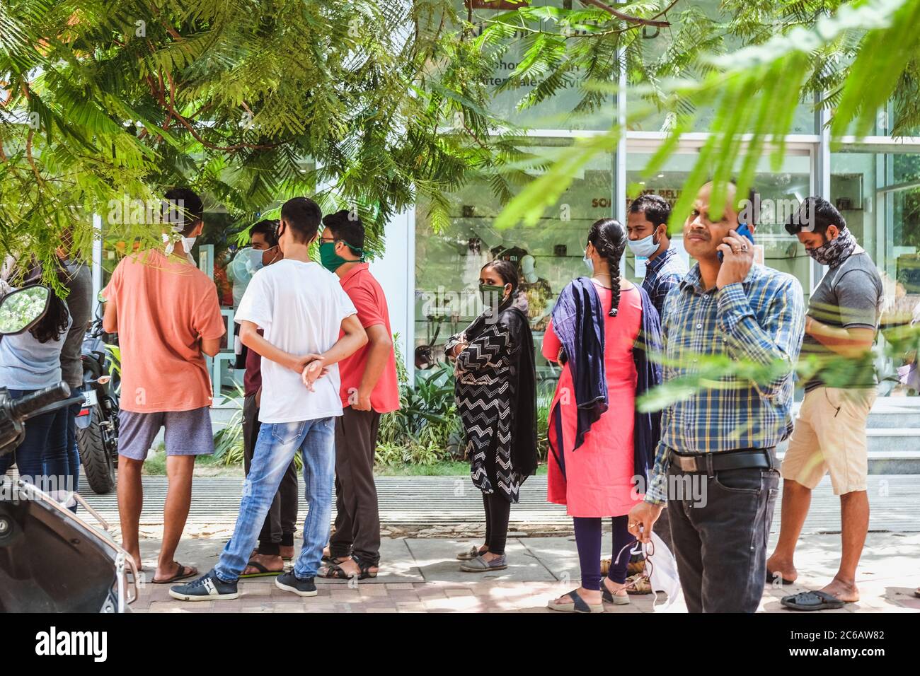 Bangalore, India - May 31, 2020. Citizens stand in line to shop during a pandemic. Bangalore India Stock Photo