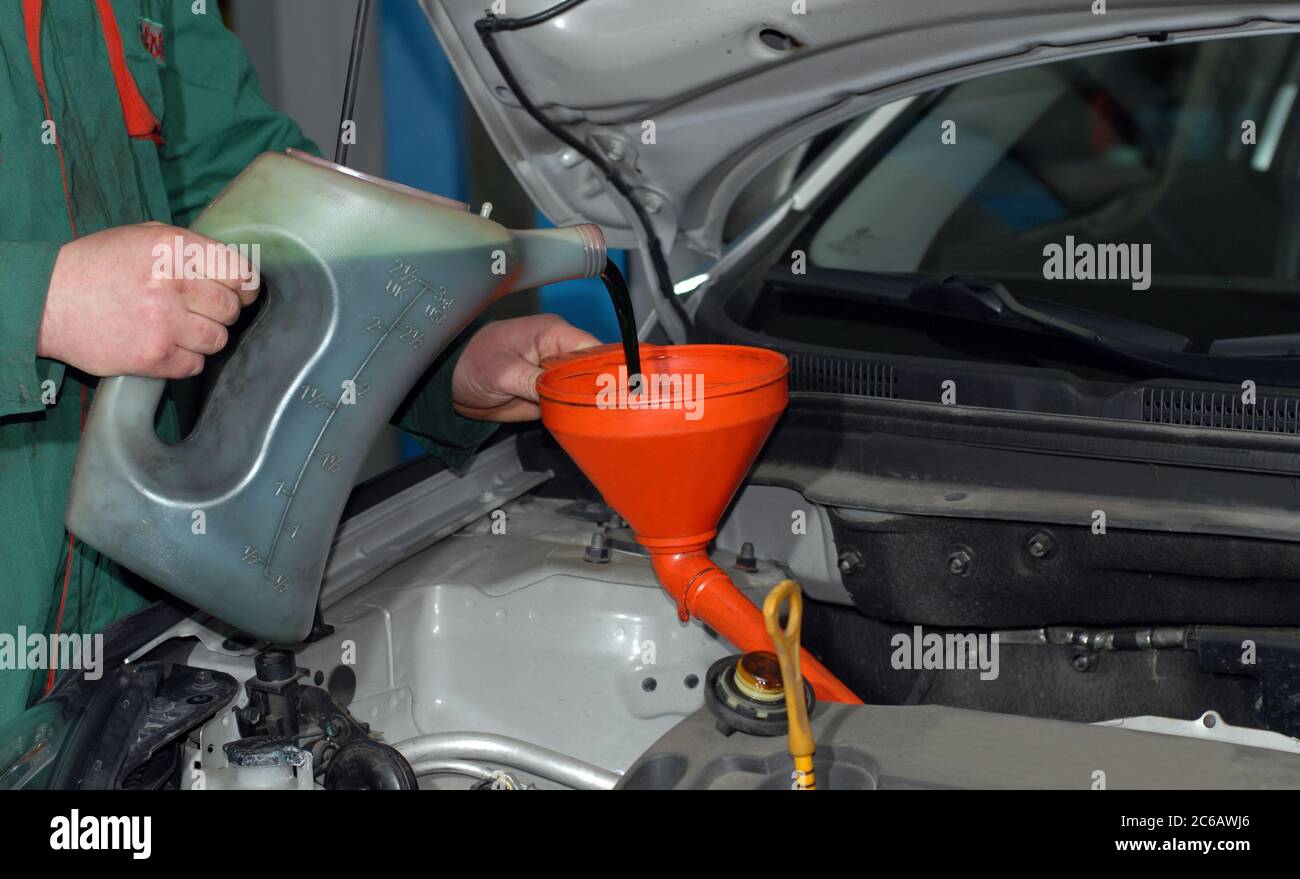 Adding Oil to a Car Stock Photo Alamy