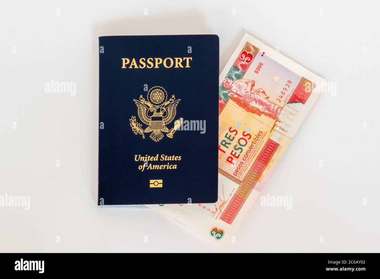American passport and convertible cuban peso currency. Concept photo for American trade, commerce, business, and tourism with Cuba. Stock Photo