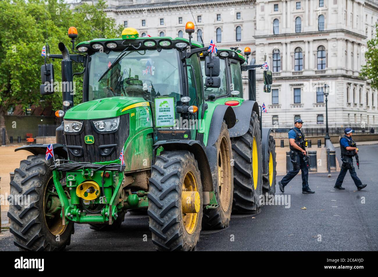London, UK. 08th July, 2020. Finishing on Horse Guards - A slow convoy of tractors drives from New Covent Garden Market to Westminster to object to a possible trade deal with the USA that does not respect British food standards. Save British Farming and Extinction Rebellion protest on the day Rishi Sunak delivers a summer economic update to Parliament. Credit: Guy Bell/Alamy Live News Stock Photo
