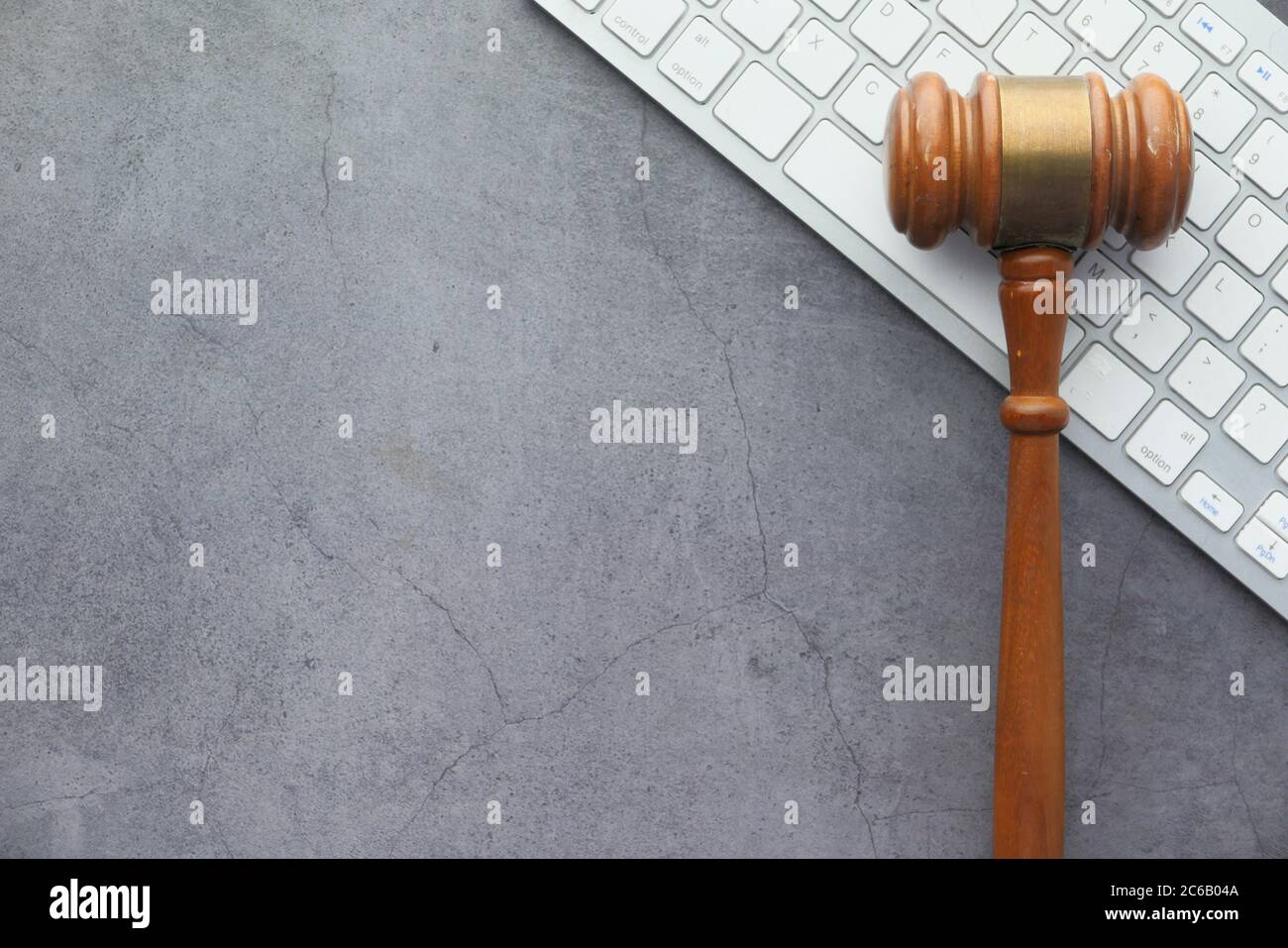 gavel on keyboard on black background with copy space  Stock Photo