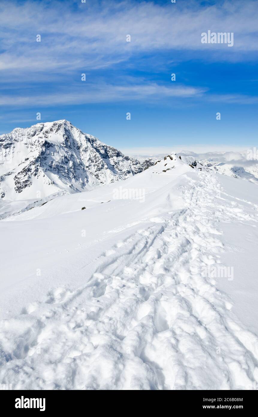 Tracks in the deep snow on a mountain peak in winter Stock Photo - Alamy