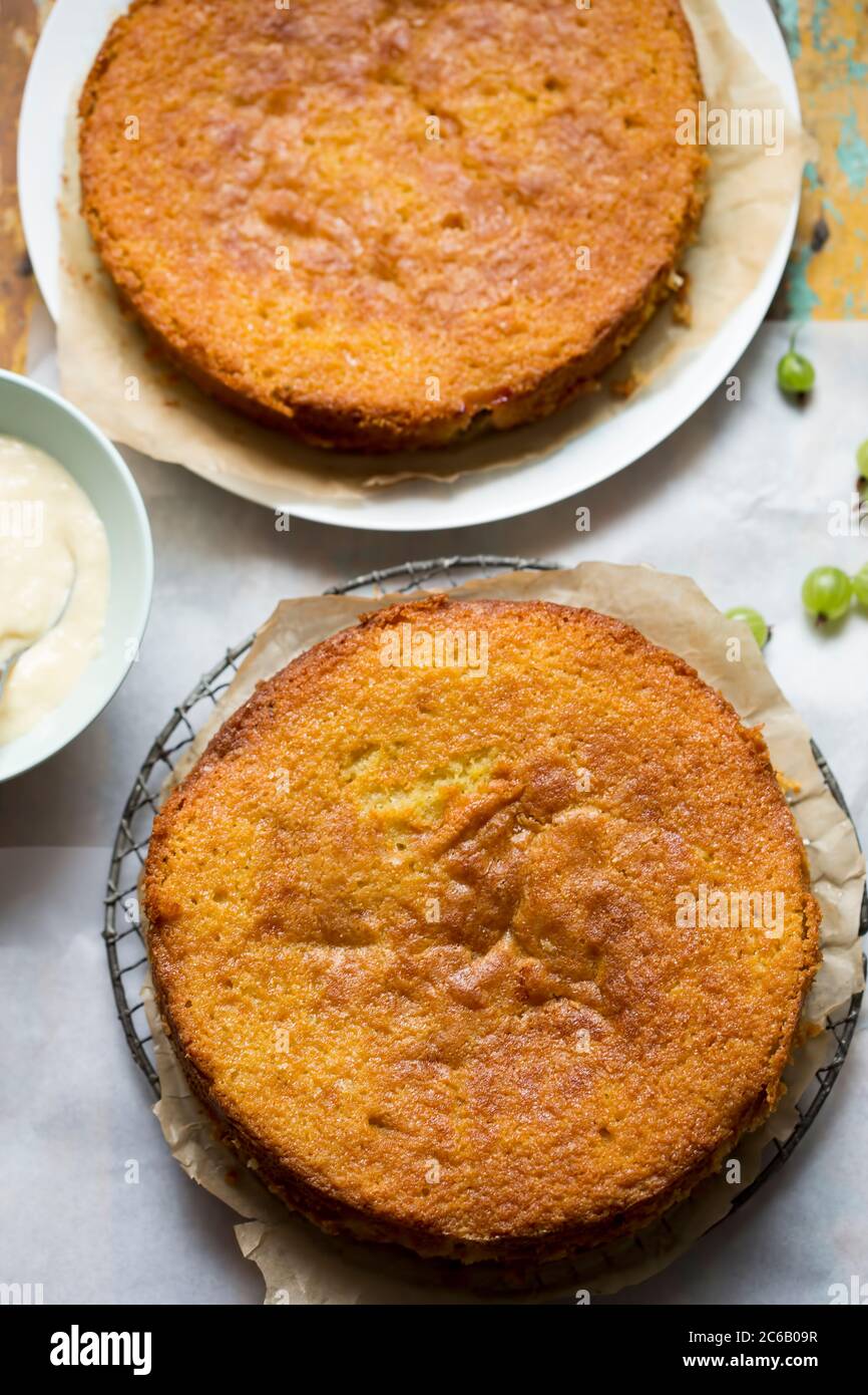 Sticky gooseberry saffron cake with vanilla custard Stock Photo Alamy