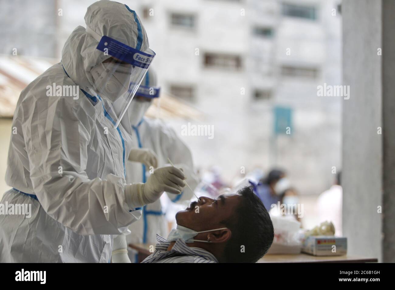 Kathmandu. 8th July, 2020. A man takes a polymerase chain reaction (PCR