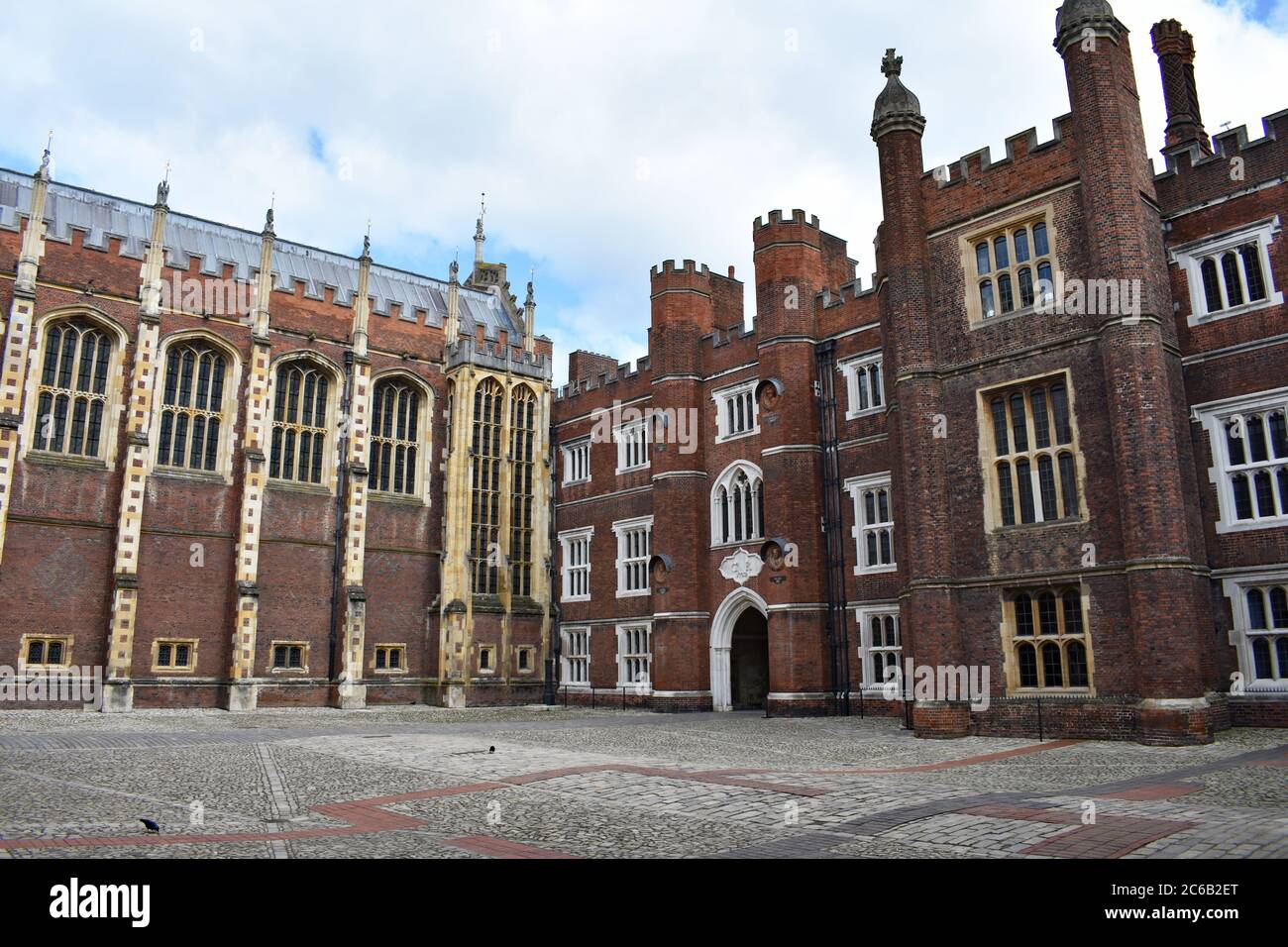 The Great Hall and Henry VIII's living quarters seen from the Clock Court in Hampton Court Palace, London. Tudor architecture and brickwork. Stock Photo