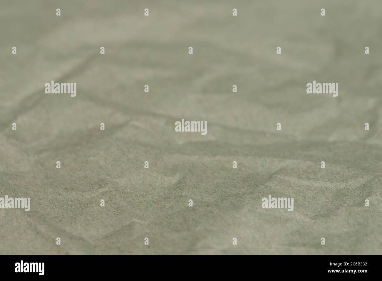creased green paper background texture selective focus Stock Photo