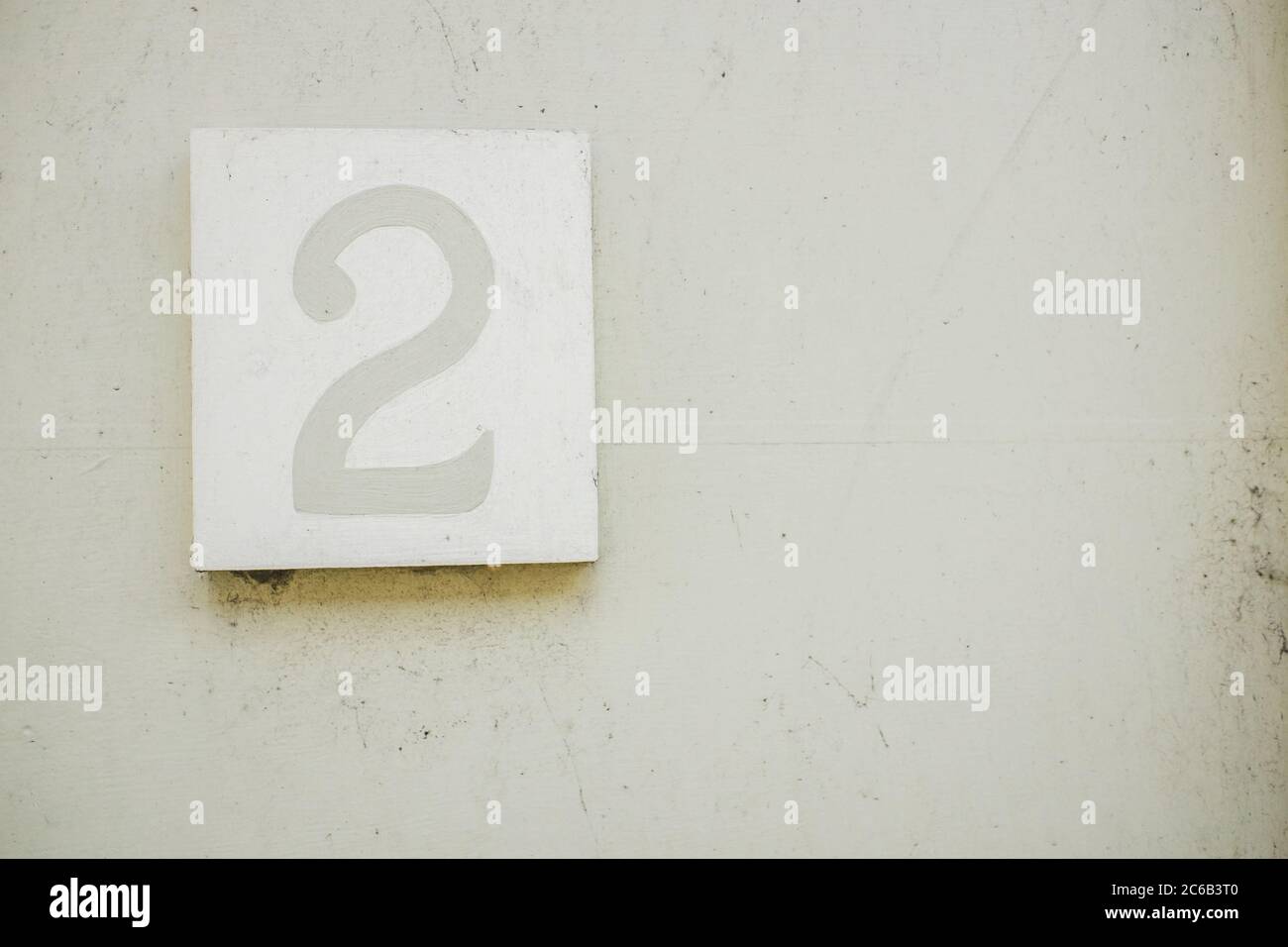 Number 2 Mounted on Doorway in grey and white UK Stock Photo - Alamy