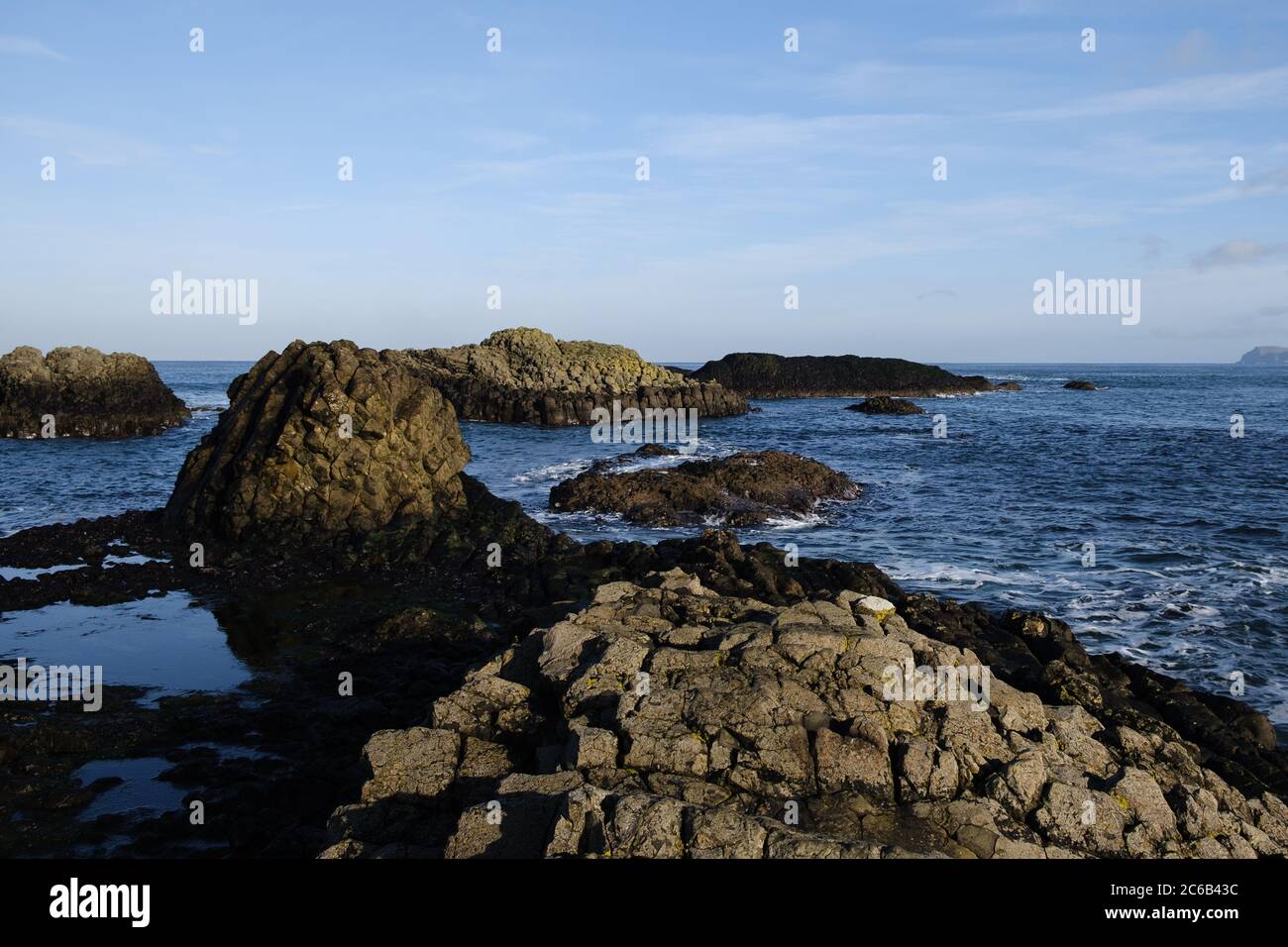 Rock formations stretching out to sea like stepping stones at the edge ...