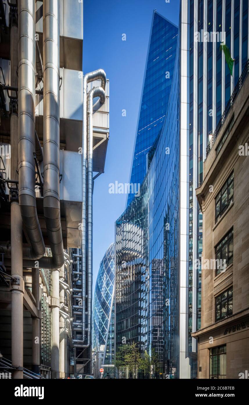 Lime Street in the financial district, with the Lloyds Building, the Scalpel, the Gherkin and St. Andrew Undershaft church, City of London, London, En Stock Photo