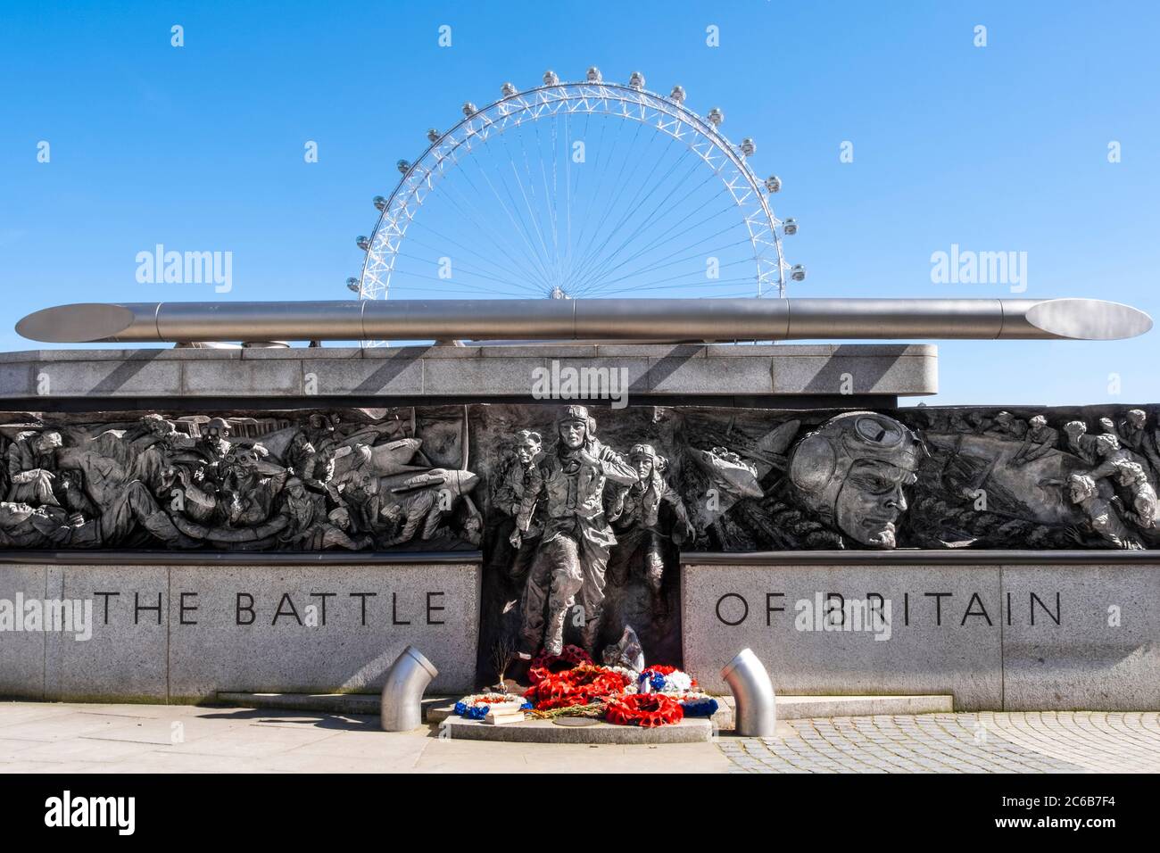 The RAF Battle of Britain Memorial Monument by British sculptor Paul Day, with the London Eye behind, London, England, United Kingdom, Europe Stock Photo