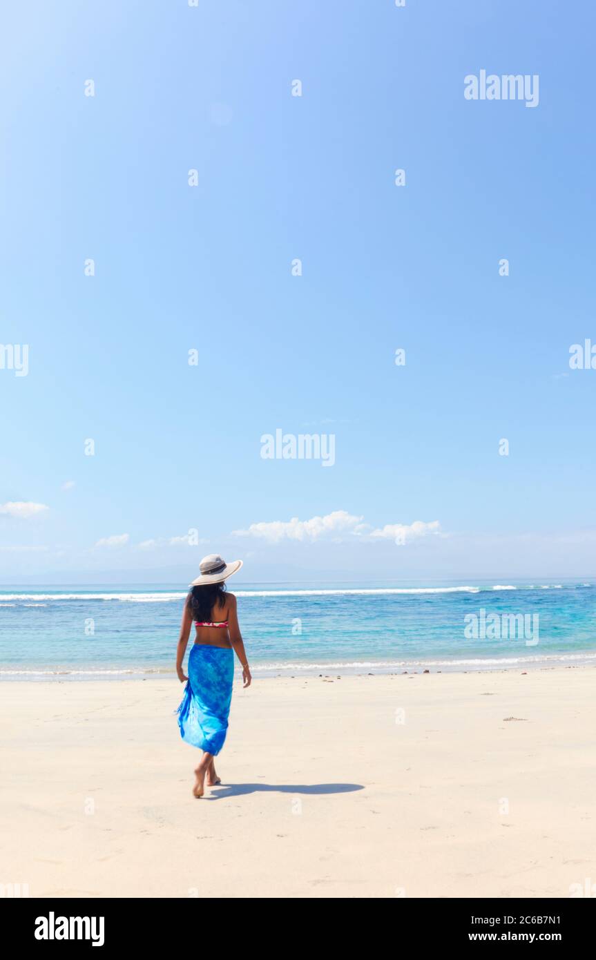 Young Woman without Bra on the Tropical Beach of Bali Island