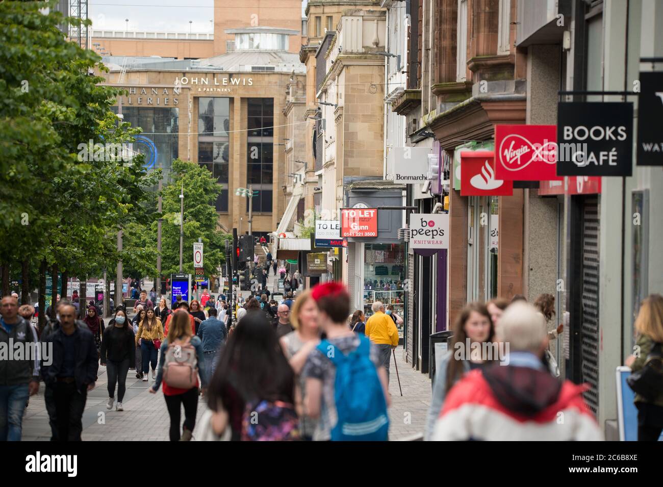 Glasgow, Scotland, UK. 8th July, 2020. Pictured: People out shopping in Glasgow City Centre as the coronavirus (COVID19) lockdown has eased, and from this Friday 10th July, people will be required to wear a face covering when going into a shop in a bid to stop the spread of the coronavirus. Credit: Colin Fisher/Alamy Live News Stock Photo