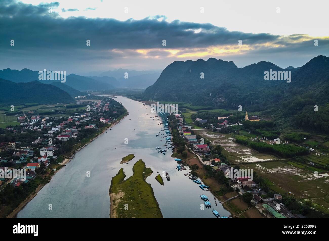 Aerial of the Song Con River with the limestone mountains in the background, Phong Nha-Ke Bang National Park, UNESCO World Heritage Site, Vietnam, Ind Stock Photo