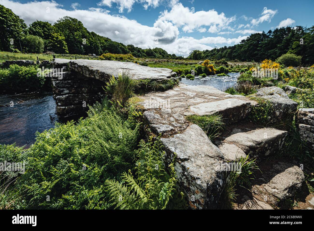 Postbridge village’s 13th century clapper bridge crossing the East Dar ...