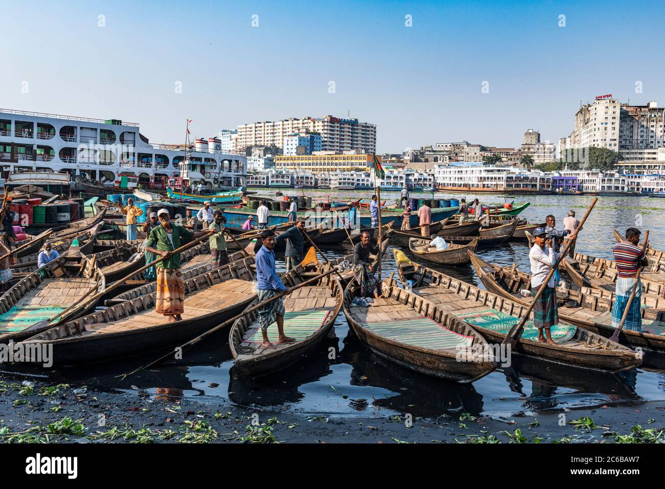 Men in their canoes waiting for new clients, Port of Dhaka, Bangladesh, Asia Stock Photo