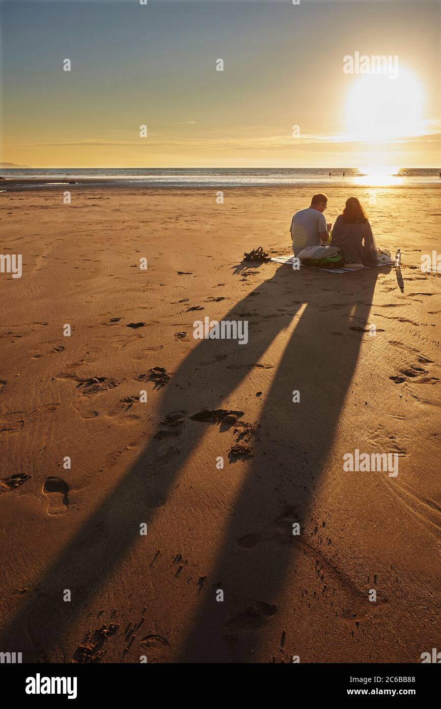 A sunset picnic on the beach, Westward Ho!, north Devon, England, United Kingdom, Europe Stock Photo