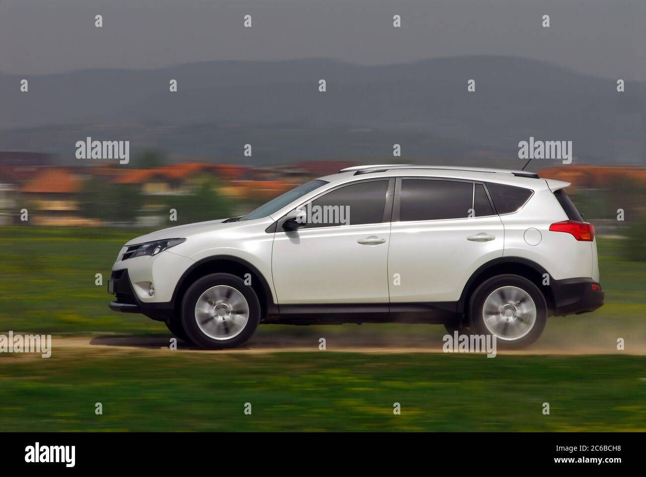 suv driving on country road Stock Photo Alamy