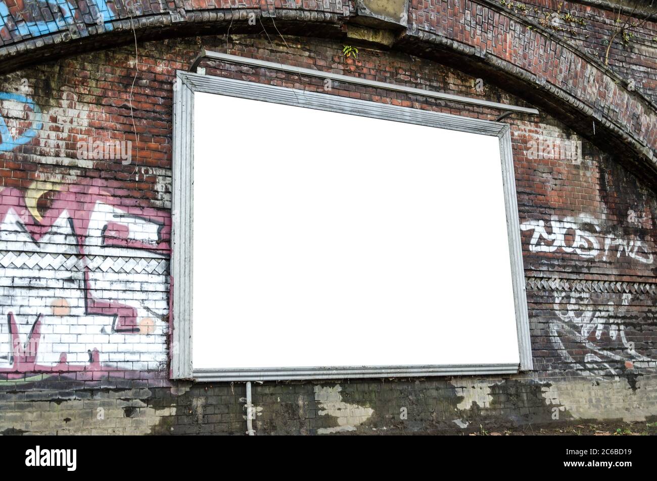 Blank billboard on brick wall with graffiti Stock Photo