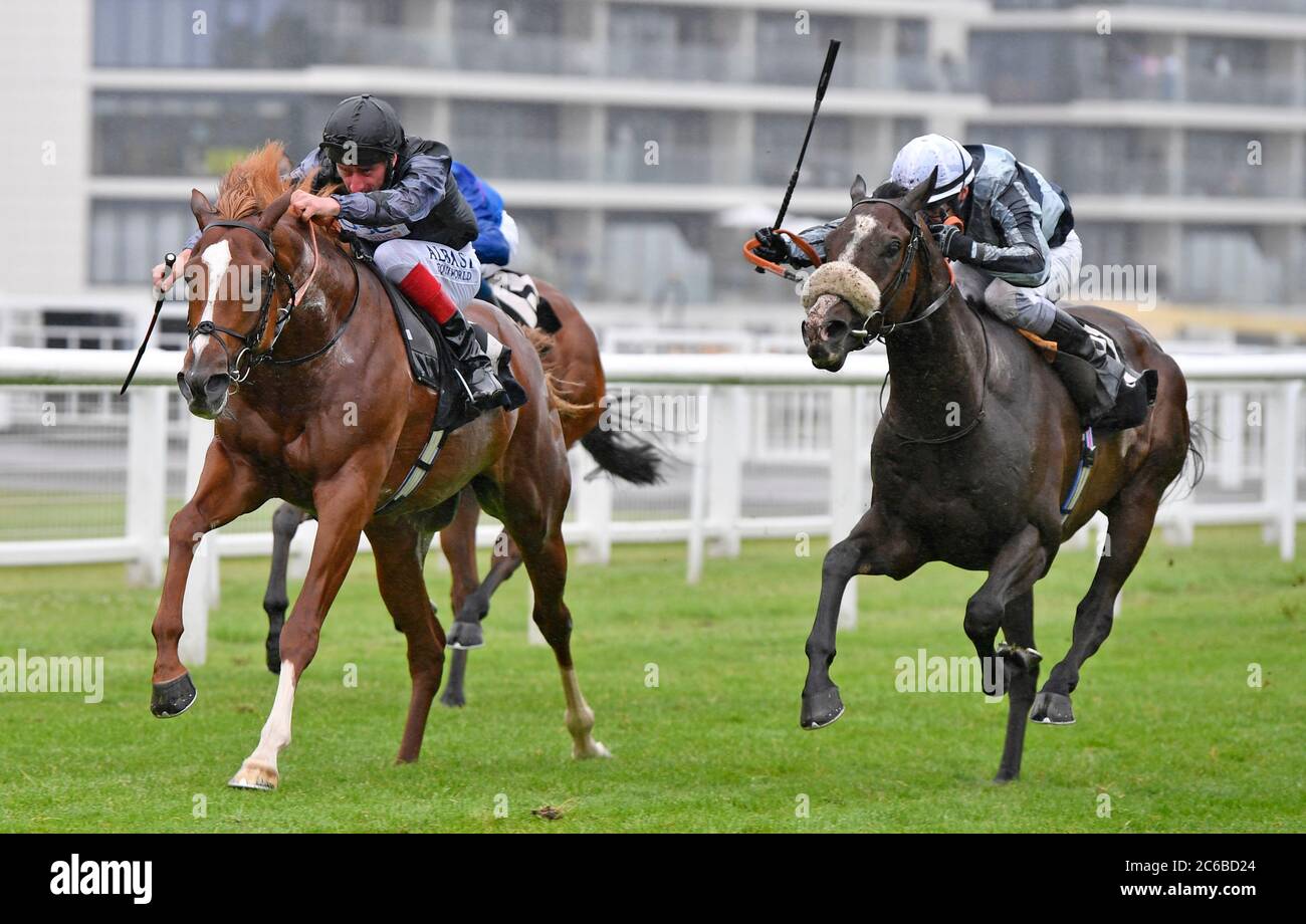 Bill The Butcher and jockey Adam Kirby win the Oakley Horseboxes Handicap Stakes at Newbury Racecourse. Stock Photo
