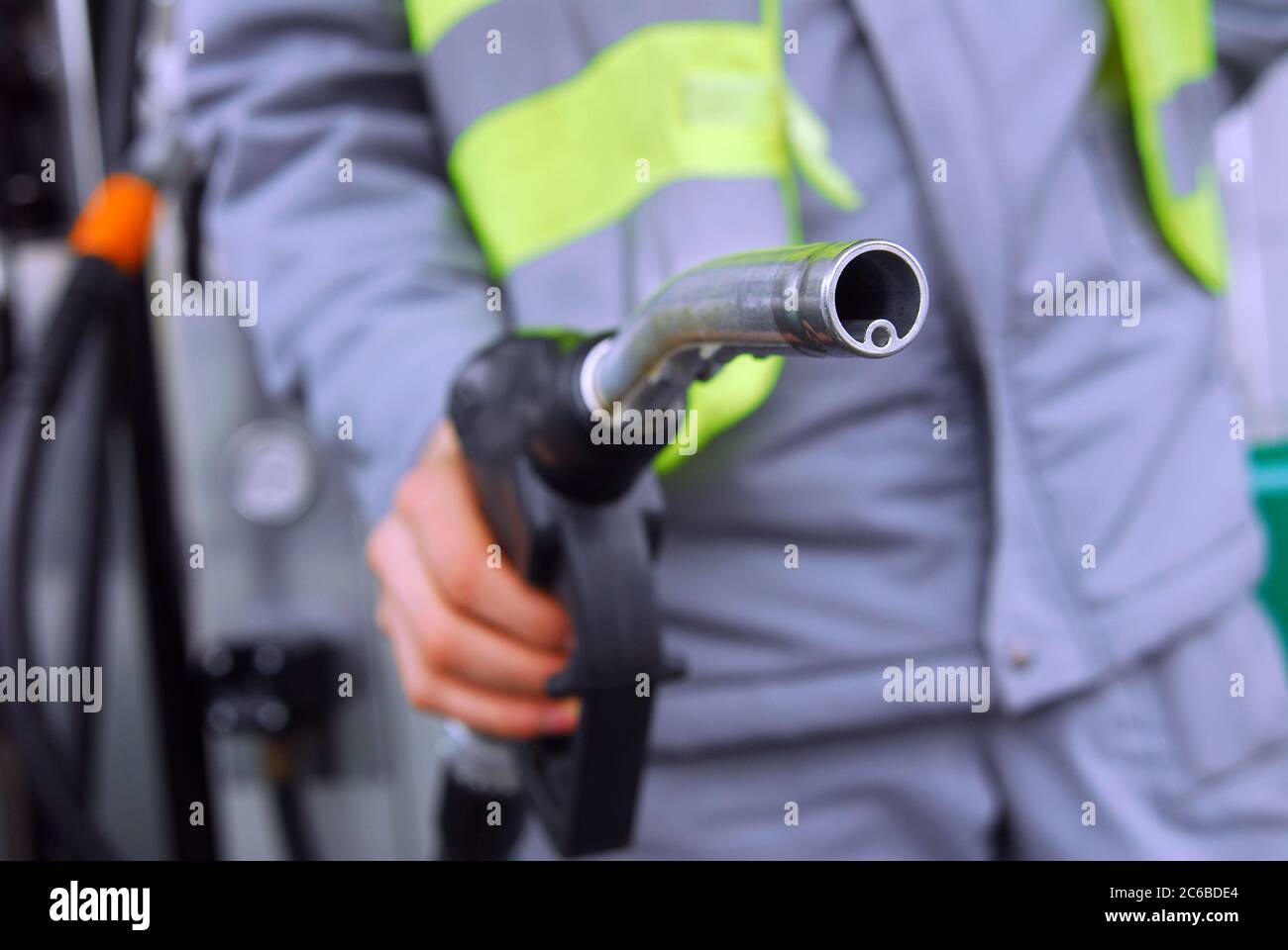 Gas Pump Nozzle, look askance at the hand holding the gas nozzle Stock