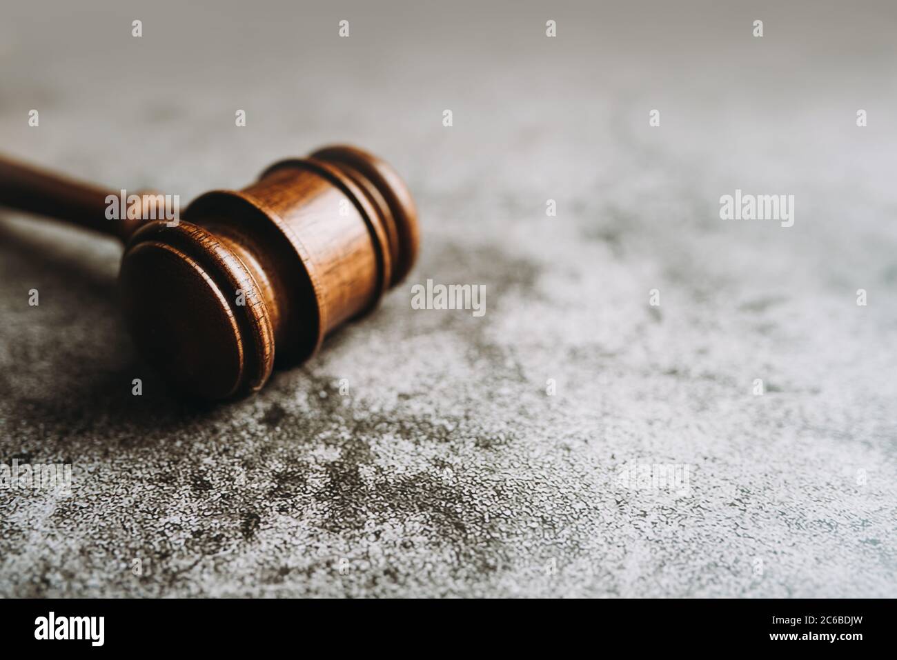 Wooden judge gavel on gray stone background, banner law concept Stock Photo