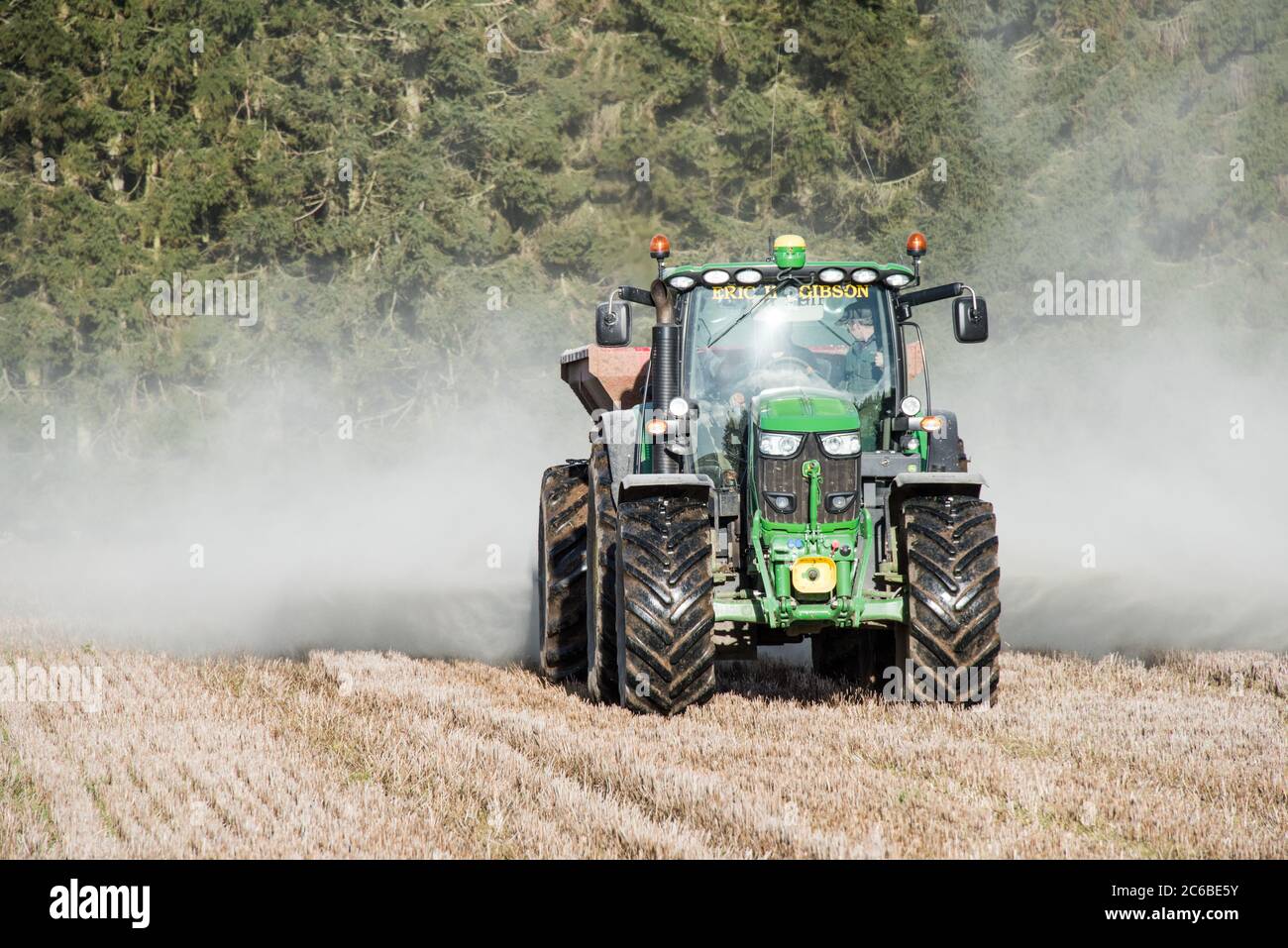 Rock dust and lime spreading on fields before cultivation. The spreading of crushed basalt could remove vast amounts of CO2 from the air Stock Photo