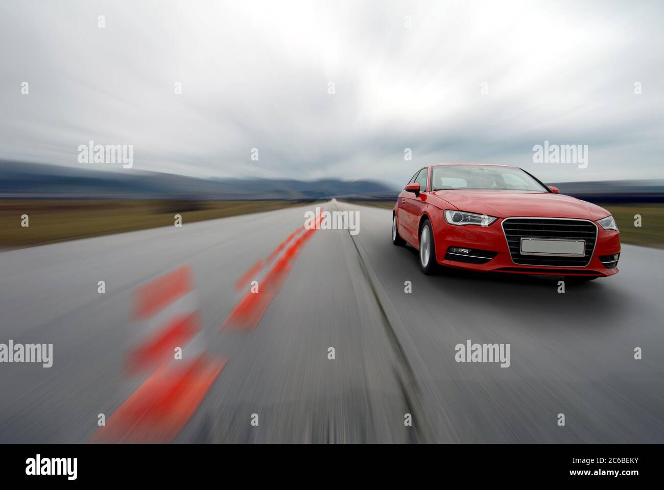 driving too fast, red car driving to fast, driving too fast, braking distance, stopping Stock Photo