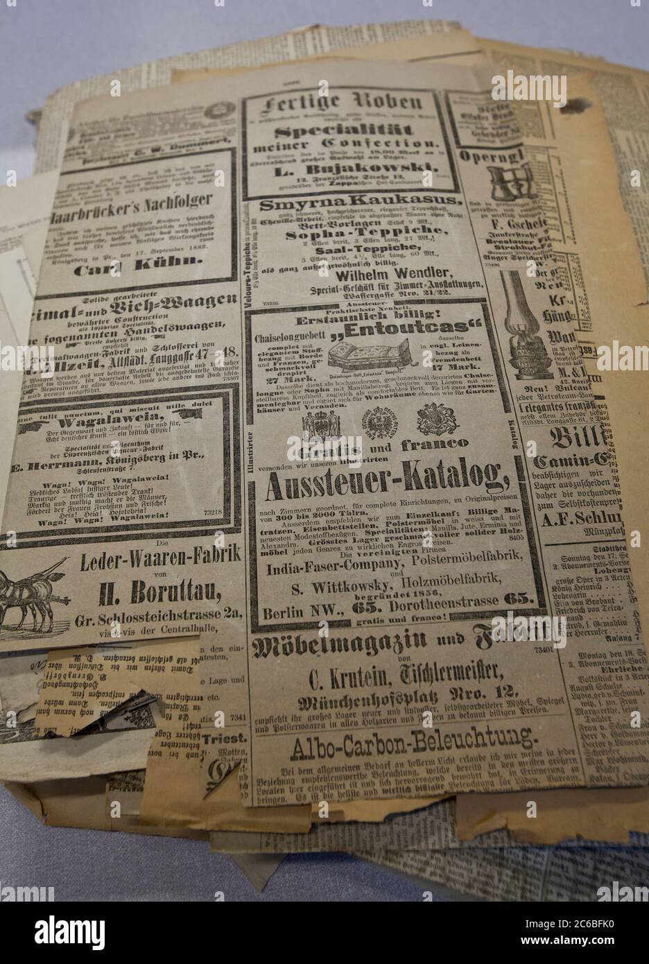Old news cuttings, old newspapers, ads, adverts, 1900's, Berlin advertisements, 1800's, specimens, conservator, curator, German, Deutsche,Deutschland Stock Photo
