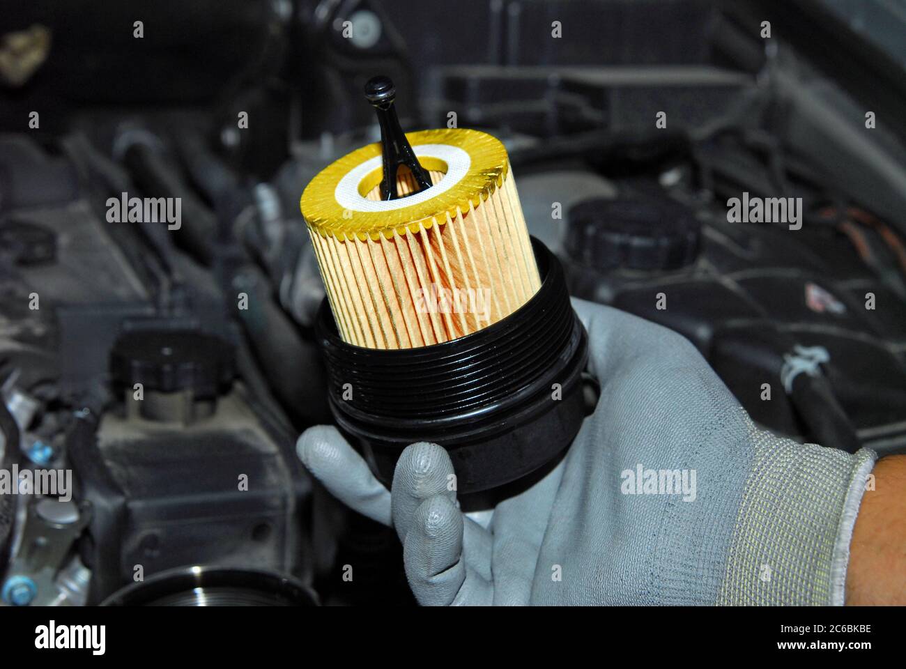 replacement of oil filter, remove car oil filter Stock Photo Alamy