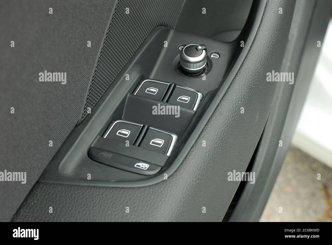 side mirror switch control and window button, car interior detail Stock Photo Alamy