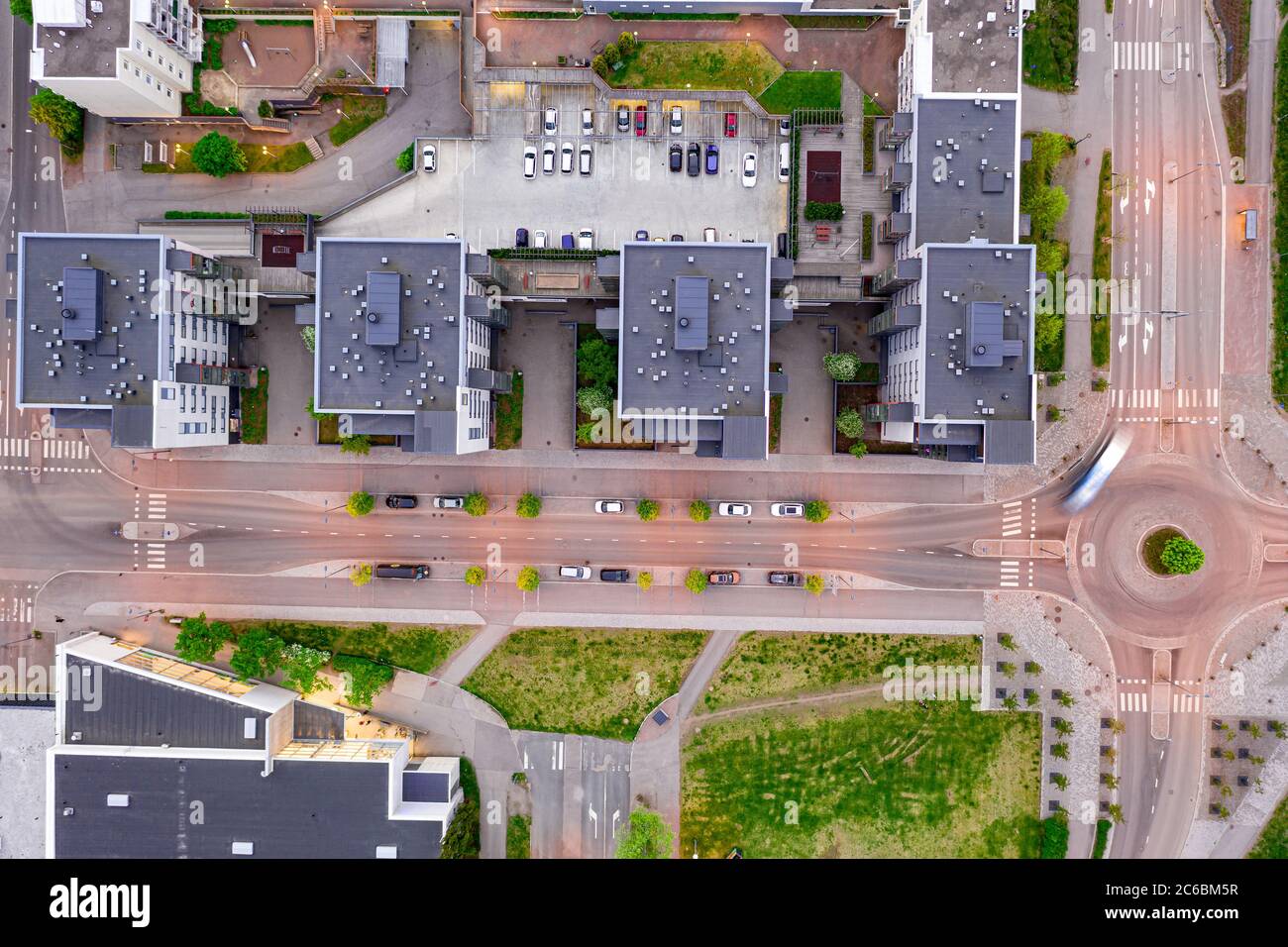 Aerial view to the modern apartment complex and street in summer