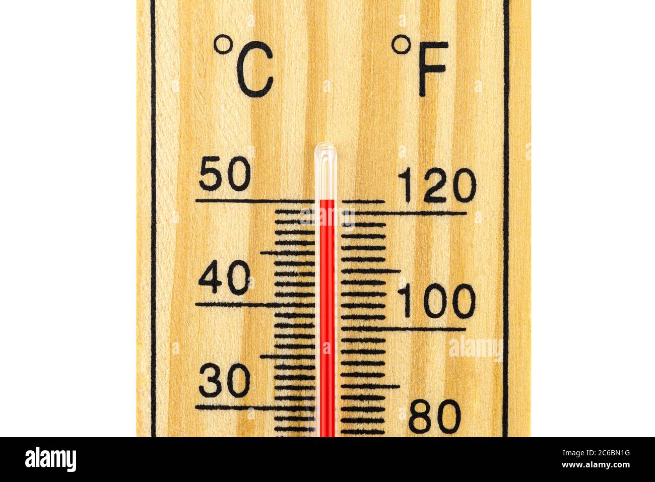 A macro shot of a classic wooden thermometer showing a temperature of 50 degrees Celsius, 122 degrees Fahrenheit, isolated on a white background with Stock Photo