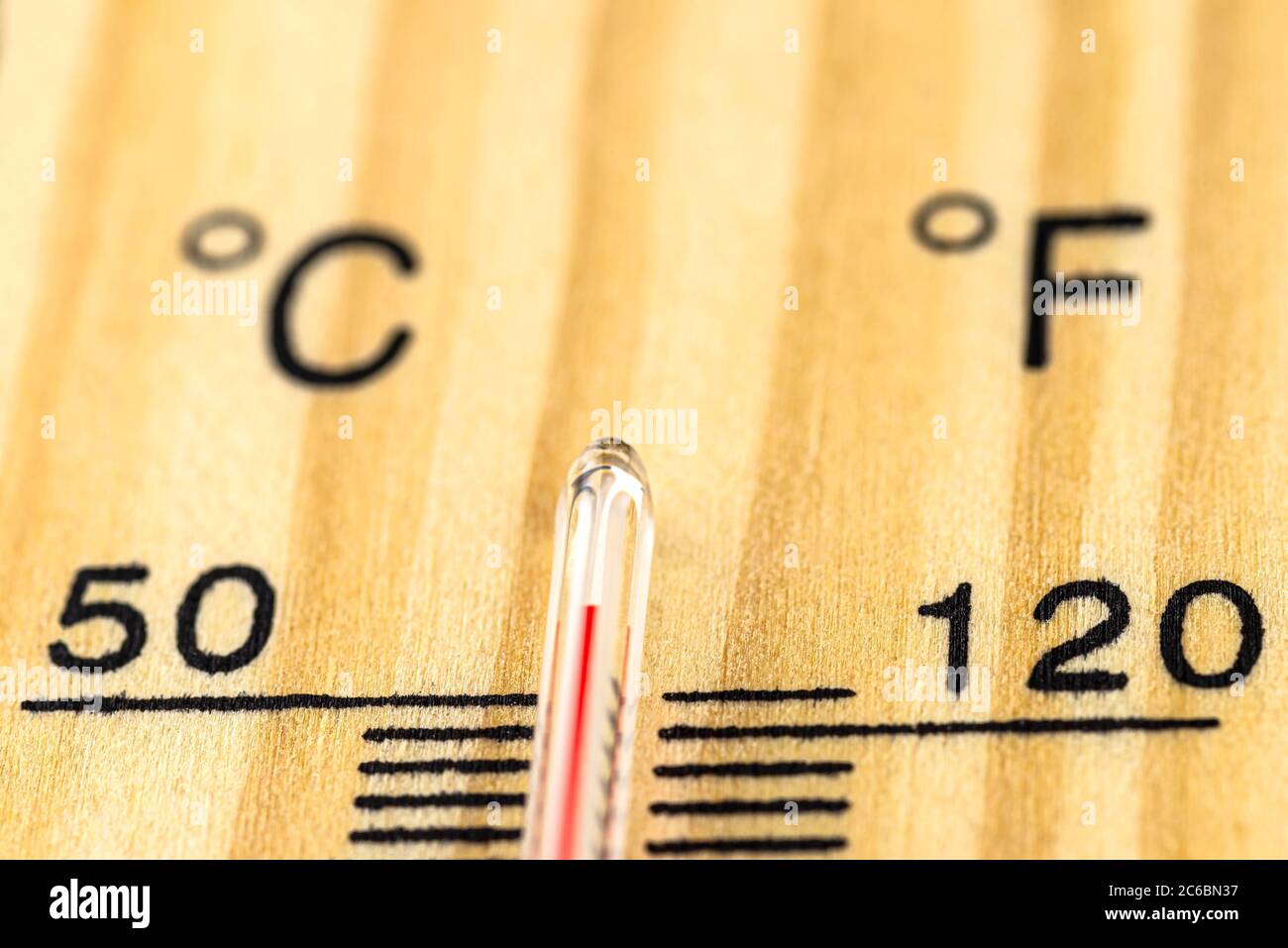 A macro shot of a classic wooden thermometer showing a temperature over 50  degrees Celsius, 122 degrees Fahrenheit Stock Photo - Alamy