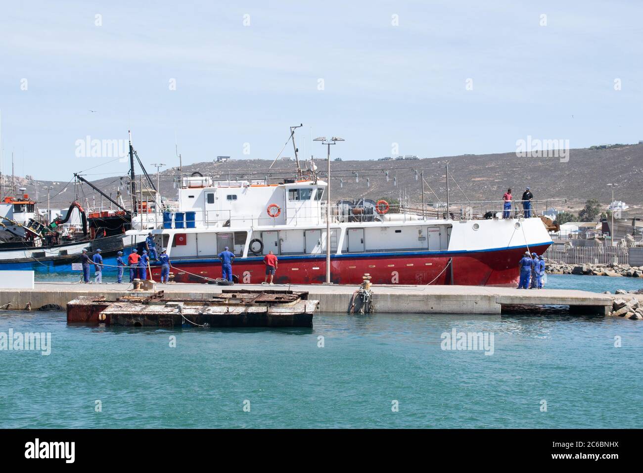 Fishing boat docked in a harbour. Stock Photo