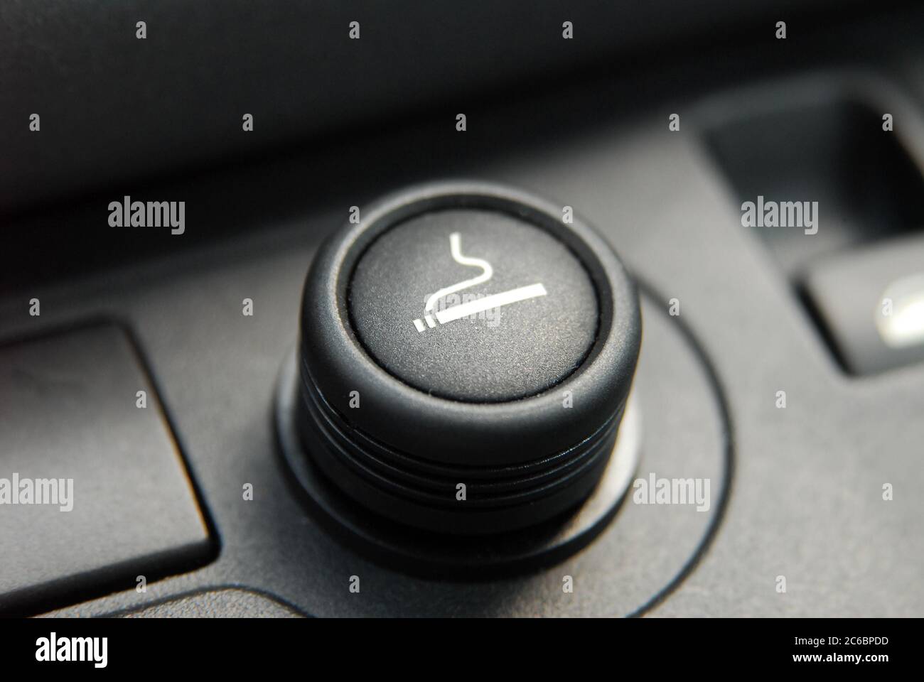 Car cigarette lighter. Cigarette lighter on the dashboard of a