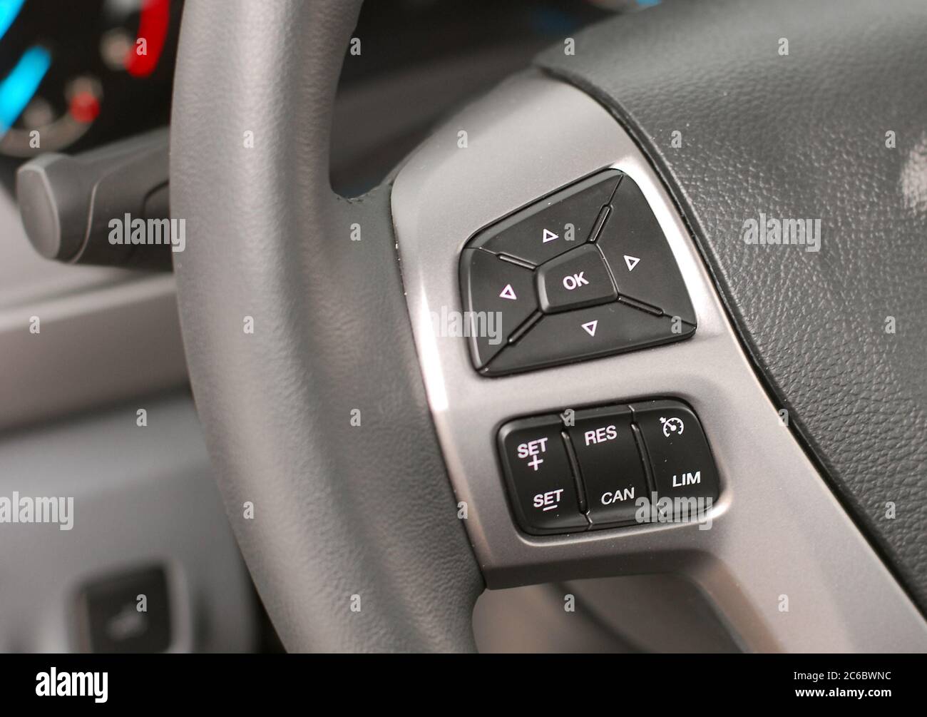 Steering wheel button. Detail on the steering wheel with controls Stock