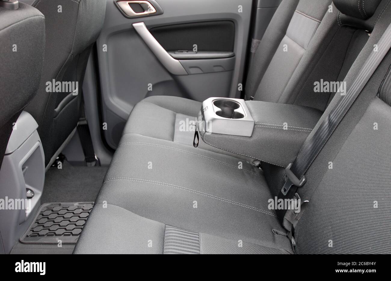armrest in the car with cup holder for rear seats row Stock Photo - Alamy