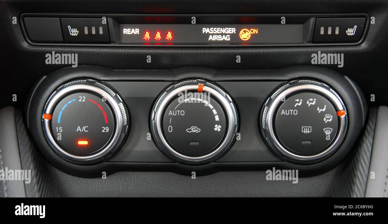 manual switches the air conditioning on the dashboard of the car Stock  Photo - Alamy, image size:1300x752