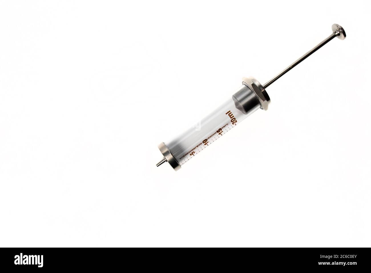 Glass syringe on a white background. Laboratory equipment. Vaccination