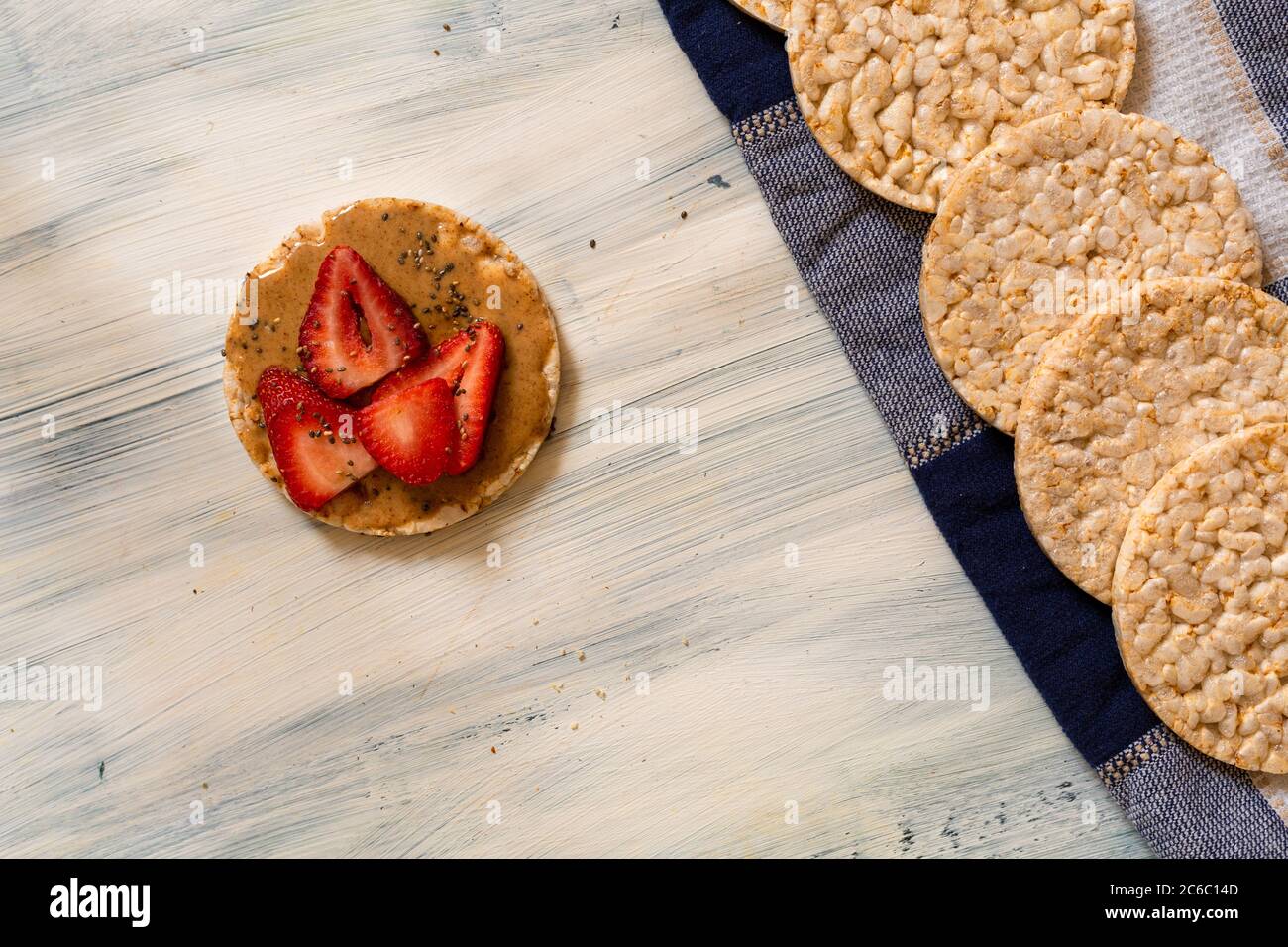 Rice cookies, with almond cream and strawberries, for diet. Stock Photo