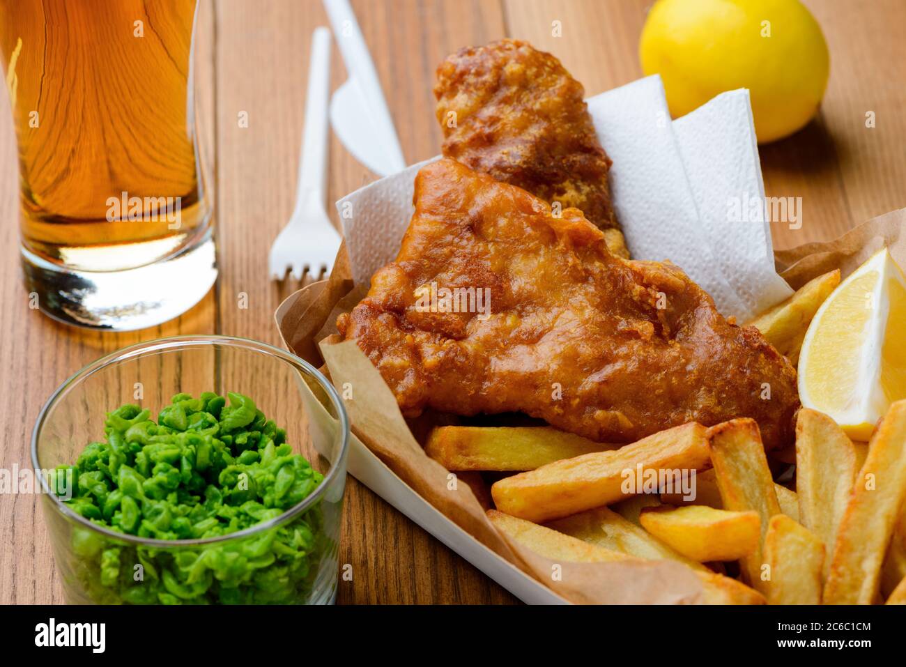 Close up fish and chips with mashed green peas Stock Photo