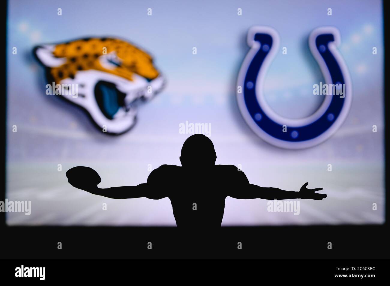 Jacksonville Jaguars vs. Indianapolis Colts. NFL Game. American Football League match. Silhouette of professional player celebrate touch down. Screen Stock Photo