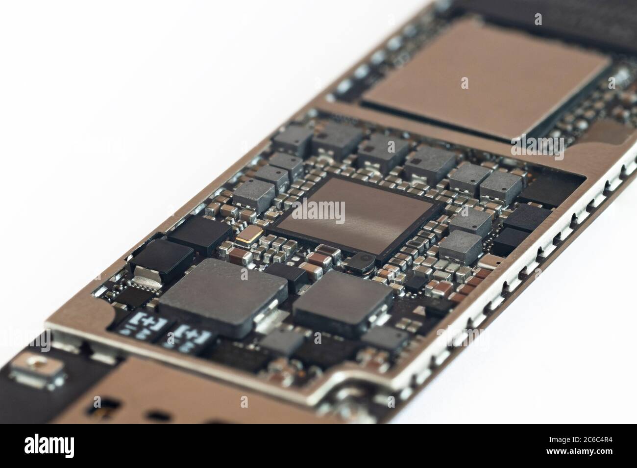 Close-up of a circuit board from the modern mobile tablet phone with CPU RAM chips and other electronic component. Stock Photo